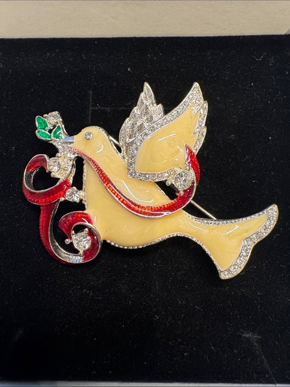 Elegant Dove Brooch Pin with Red Ribbon and Green Leaf Accent
